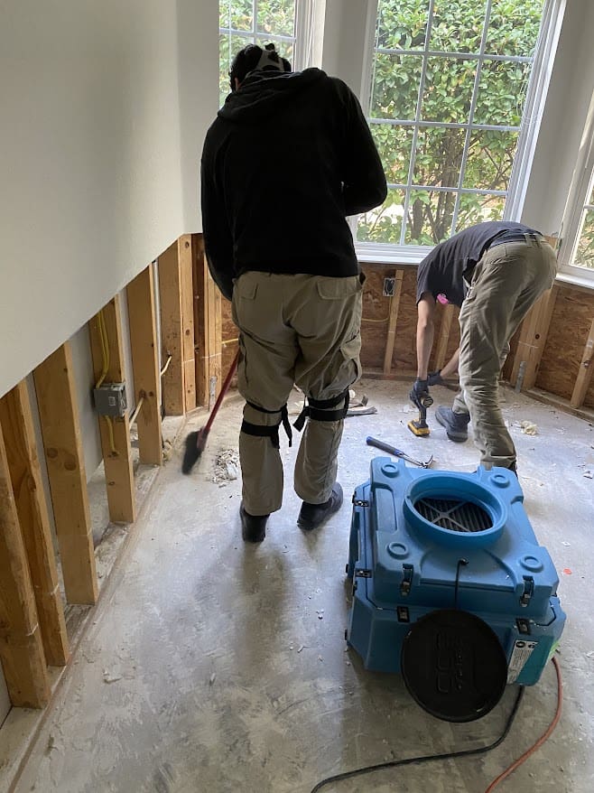 Water damage restoration technicians responding to a flood emergency in Delaware - 24/7 emergency water extraction and structural drying service